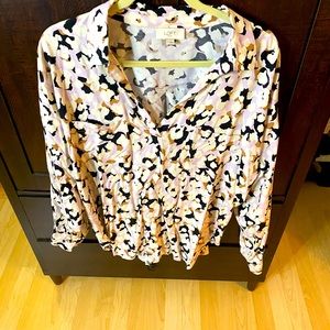 Black and white blouse also has some lilac and tan